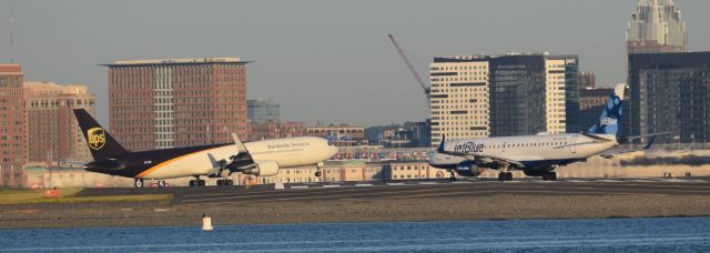 BOEING 767-300 (N312UP) - UPS 1013 lands 33L while a jetBlue e190 prepares to depart 27