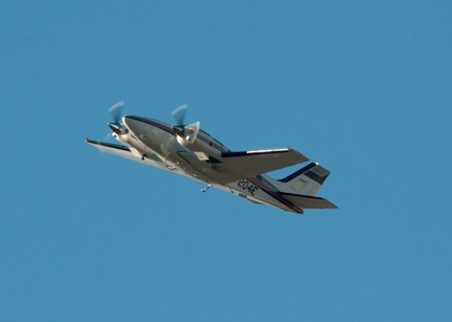 Beechcraft 56 Turbo Baron (N7204E) - Aircraft on left cross wind from 27 at Carson City