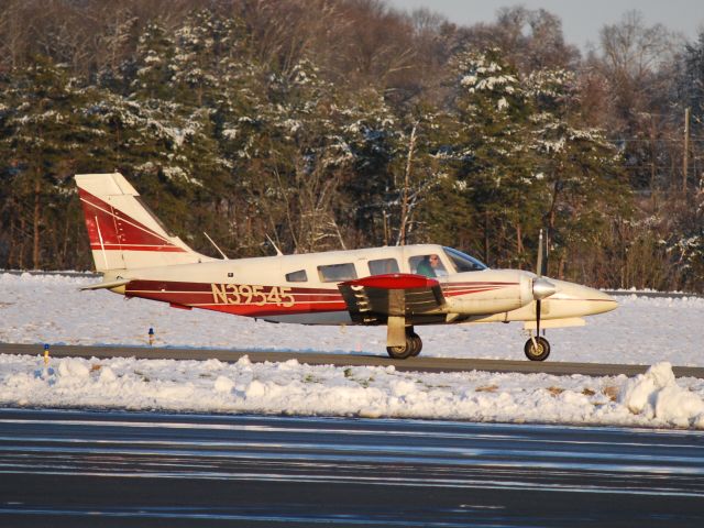 Piper Navajo (N39545) - Taxiing to runway 02 at Concord Regional Airport - 3/2/09