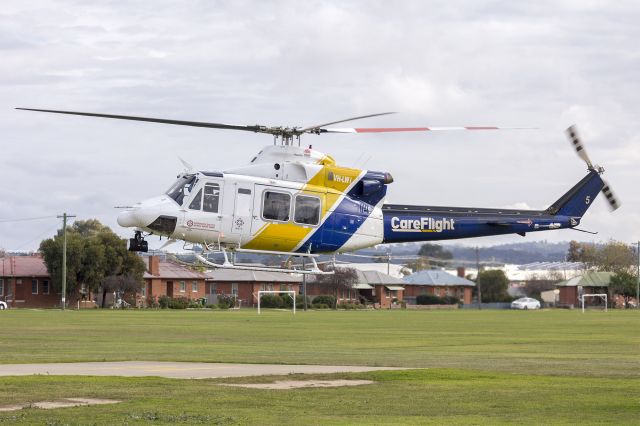 Bell 412 (VH-LWI) - CareFlight (VH-LWI) Bell 412EP departing the Duke of Kent Oval (YXWG) helipad.