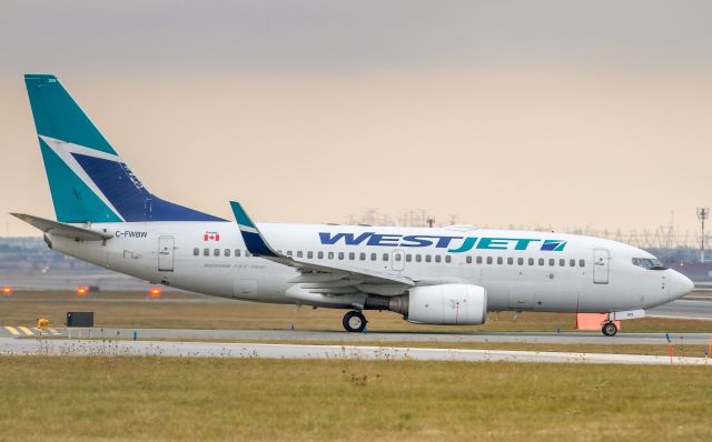 Boeing 737-700 (C-FWBW) - Lining up for a runway 23 departure...