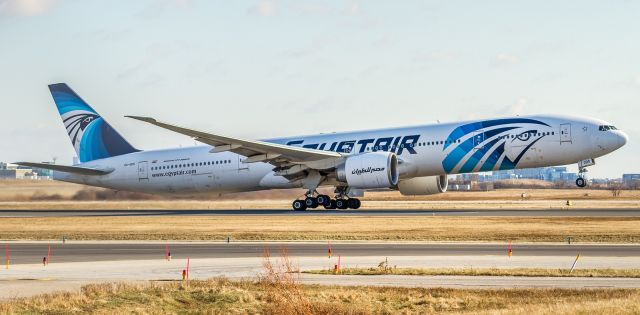 BOEING 777-300ER (SU-GDO) - Slightly one-sided rotation and climb off runway 23 for the trip back to Cairo