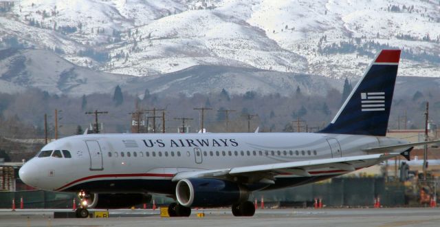 Airbus A319 (N825AW) - Flashback (Twelve years ago back to 2010) ~~br /AWE's N825AW turning from Alpha to line up on Runway 16R.br /In 2013, three years after this photo was snapped, US Airways threw a life preserver to American Airlines by proposing a merger.  American, which had filed for bankruptcy, agreed to the merger offer and by mutual agreement, and despite the fact that it was US Airways that was saving bankrupt American, the name US Airways was "retired" and the American Airlines name was retained*.br /* It was felt that the name American Airlines was a more recognizable and popular name with the US citizenry and worldwide air travelers.