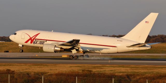 BOEING 767-200 (N774AX) - N744AX, part of the fleet of ABX's 767-200s, touches down on runway 33L. This aircraft was landing from KCVG, which is only about a 1 hour flight typically.