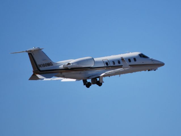 Learjet 60 (N160MG) - FLYING ACES LLC departing runway 36R at KCLT - 3/7/13