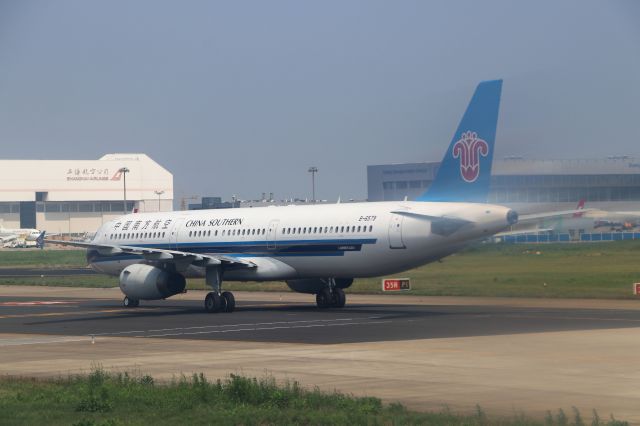 Airbus A321 (B-6579) - 6/25/18 China Southern crossing Rwy 35R as it taxis in to Pudong