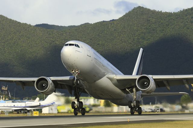 Airbus A330-200 (F-GZCE) - Airfrance F-GZCE departing TNCM St Maarten for Paris.br /Photo was taken from El Zaphiro Restaurant. 