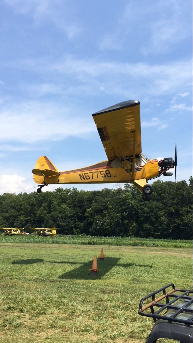 Piper L-21 Super Cub (N6775B) - N6775B picking up a banner.