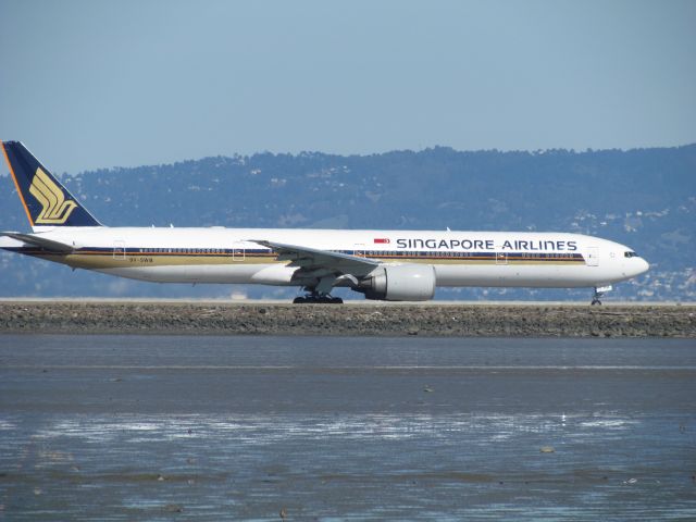 BOEING 777-300ER (9V-SWB) - Taken from the Bayshore Pathway, at SFO. Singapore 15 getting ready for takeoff to Incheon (Seoul), then to Singapore.