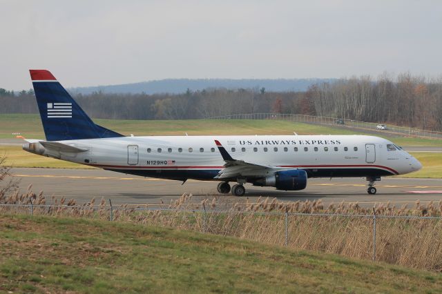 Embraer 170/175 (N129HQ) - Republic ERJ-175 holding short of runway 24.