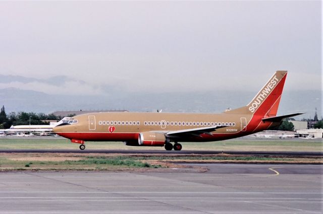 BOEING 737-300 (N328SW) - KSJC - Kmart 737 rolling to 30L for departure at San Jose....date apprx July 1994