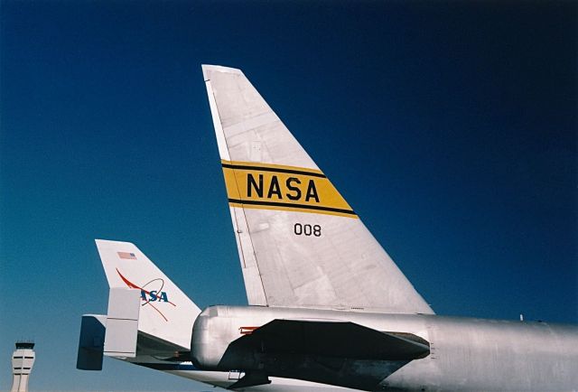 Boeing B-52 Stratofortress (52-0008) - NASA new and old. B-52B and B-747 Shuttle aircraft on display at the Edwards AFB Open House and Air Show 10-18-1997. Air Traffic Control Tower in the background.