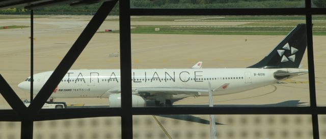 Airbus A330-200 (B-6091) - 6/28/18 Being towed out from T3-C after deplaning. Star Alliance livery