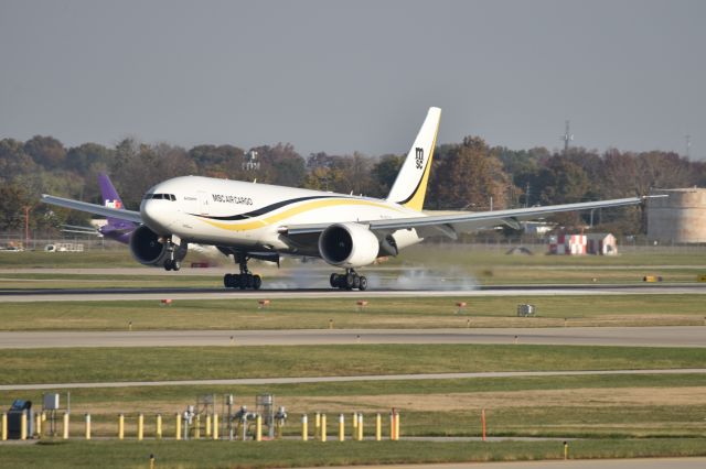 BOEING 777-200LR (N707GT) - touching down 23-R 11-05-23 about a day late from NLU.