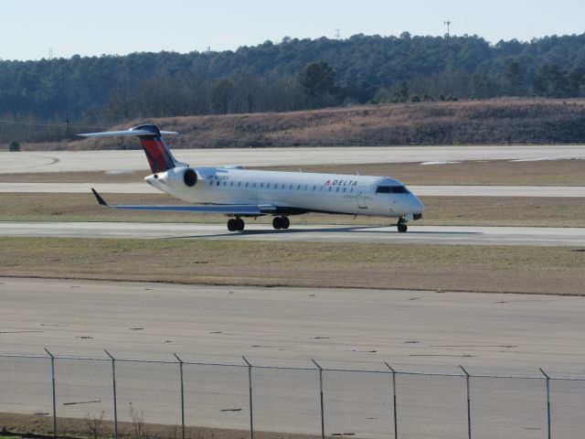 Canadair Regional Jet CRJ-700 (N738EV) - Delta Connection (ExpressJet) flight 5205 to Cleveland-Hopkins Intl, a Bombardier CRJ700 taxiing to takeoff on runway 23R. This was taken January 30, 2016 at 3:45 PM.