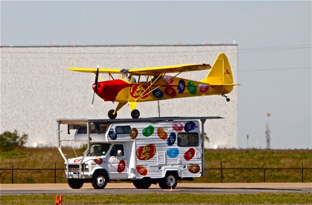 — — - ALLIANCE,FORT WORTH AIR SHOW,2009,  KENT PIETSCH LANDING HIS INTERSTATE CADET ON A MOTOR HOME DRIVEN BY BOBBY UNSER