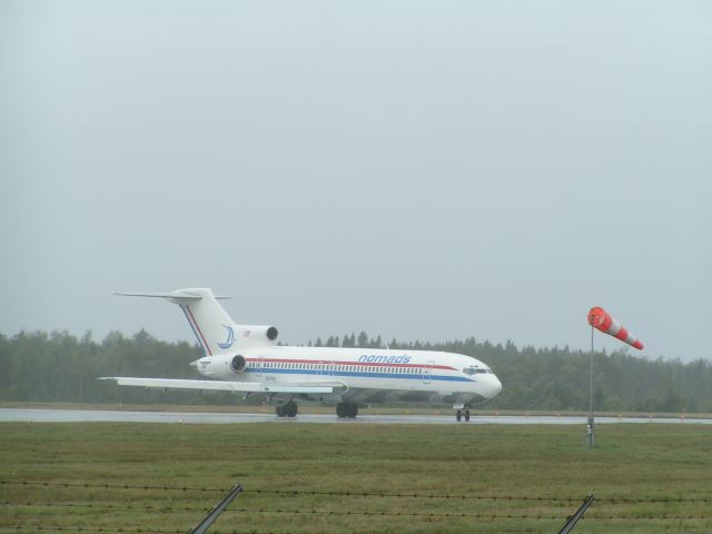 Boeing Super 27 (200) (N727M) - A rainy day in Gander. Departing to Shannon.