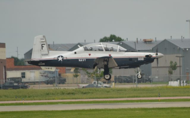 Raytheon Texan 2 (16-5998) - US Navy T-6A 165998 of TAW-6 conducting a low level fly-by of Runway 15 in Sioux Falls SD on 6-12-15