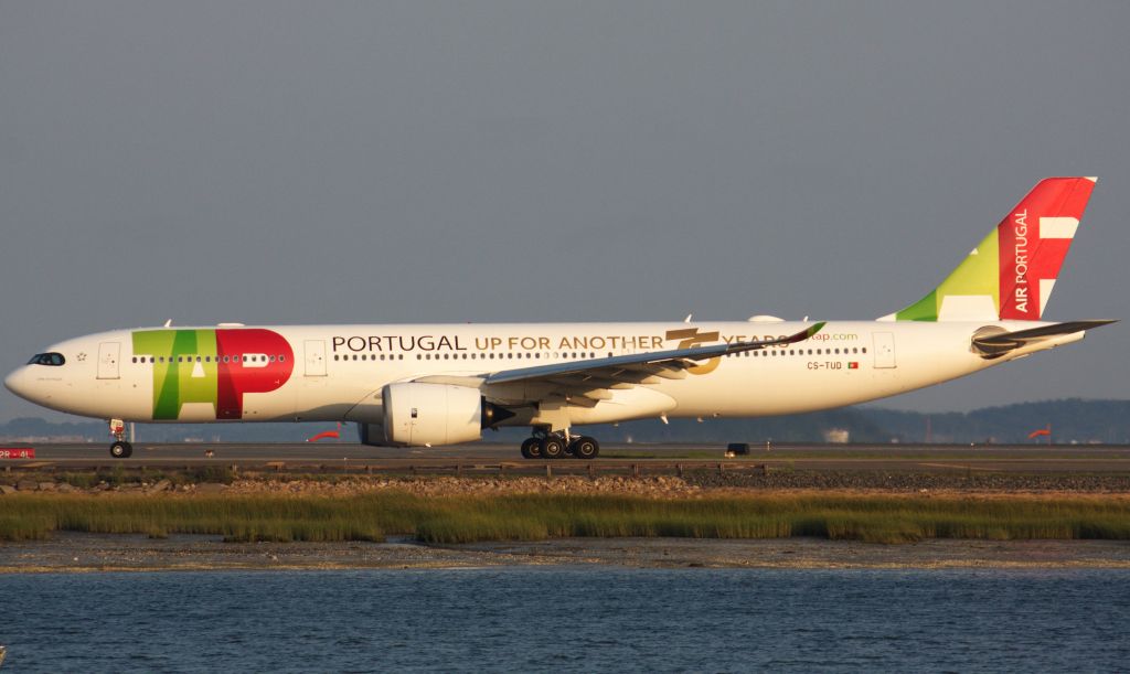 Airbus A330-900 (CS-TUD) - TAP A339 with 'Up for another 75 years' markings on the left side of the aircraft departing BOS on 8/11/21.