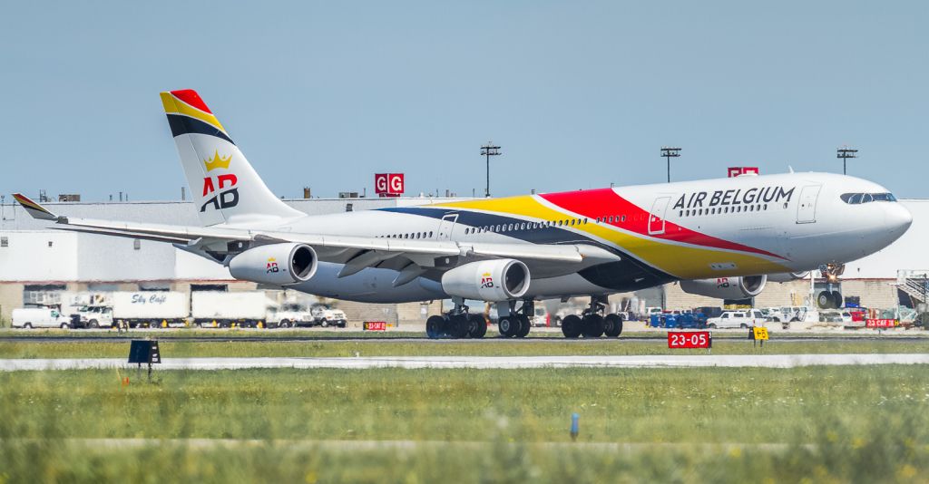 Airbus A340-300 (OO-ABB) - Air Belgium A343 touching down on runway 23 operating for British Airways while they wait for their new A350-1000's