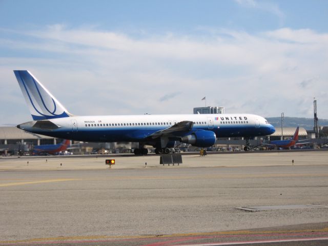 Boeing 757-200 (N553UA) - Holding on RWY 19R