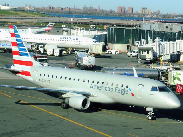 Embraer 175 (N401YX) - American Eagle/Republic Airline (AA/YX) N401YX ERJ-175 LR [cn17000363]br /New York La Guardia (LGA). American Eagle/ Republic Airline flight AA4400/YX4400 readies for departure to St. Louis Lambert (STL).br /Taken from the terminal.br /2015 11 20   a rel=nofollow href=http://alphayankee.smugmug.com/Airlines-and-Airliners-Portfolio/Airlines/AmericasAirlines/American-Eagle-AAAXCPENEVMQOHOOYVYXZW/https://alphayankee.smugmug.com/Airlines-and-Airliners-Portfolio/Airlines/AmericasAirlines/American-Eagle-AAAXCPENEVMQOHOOYVYXZW//abr / 