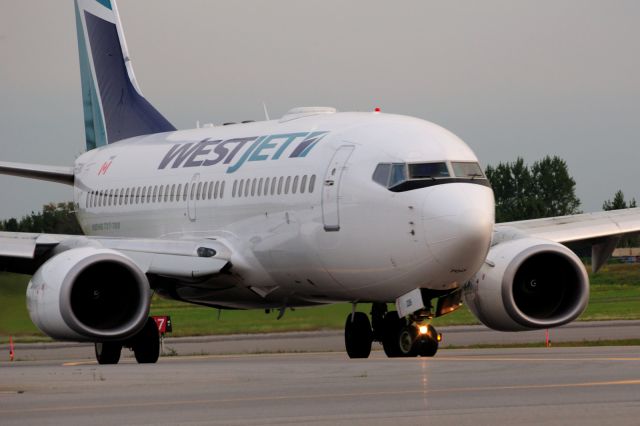 Boeing 737-700 (C-FGWJ) - Turning off Rwy 07 after a flight from Halifax (YHZ/CTHZ)