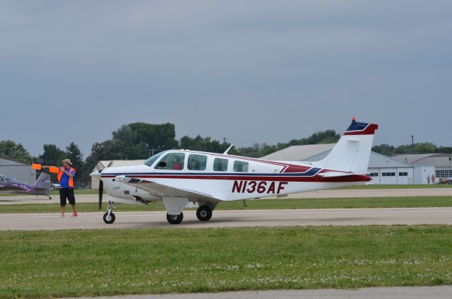 Beechcraft Bonanza (36) (N136AF) - Bonanza mass arrival at AirVenture 2014