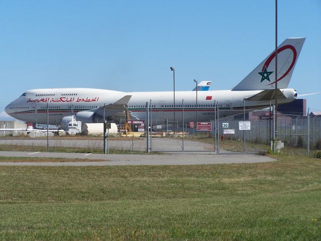 Boeing 747-400 (CN-RGA) - CN-RGA Royal Air Maroc 747-400 at Stewart Airport NY. This is the closest I have been to this aircraft so I decided to take the photo with the clutter! Here for the UN General Assembly 20 Sept 2010