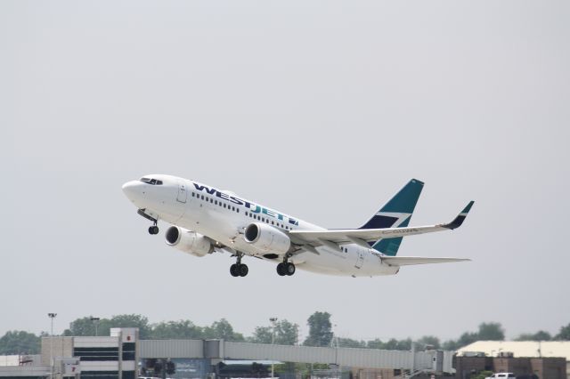 Boeing 737-700 (C-GUWS) - Departing From London International Airport,London,Canada CYXU/YXU.