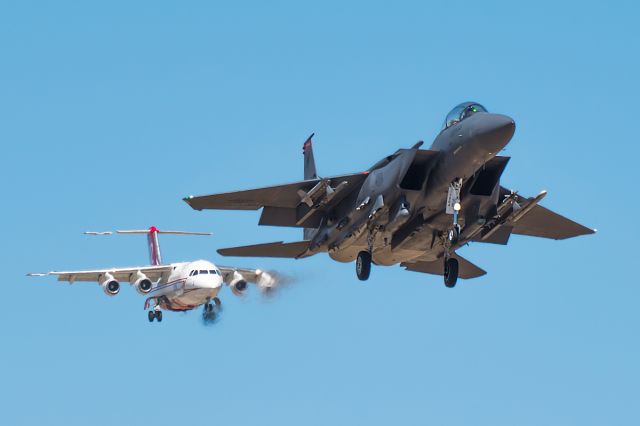 McDonnell Douglas F-15 Eagle (87-0402) - Dropper 22 cutting off the BaE146 Firebomber.  Just Kidding, he didnt.  The F15E was landing on the south runway and the BaE was landing on the north! It was a safe landing for everyone! Full Quality photo: a rel=nofollow href=http://jetphotos.net/viewphoto.php?id=8093460http://jetphotos.net/viewphoto.php?id=8093460/a If you like to see more of my stuff follow me on Instagram! boispotter 