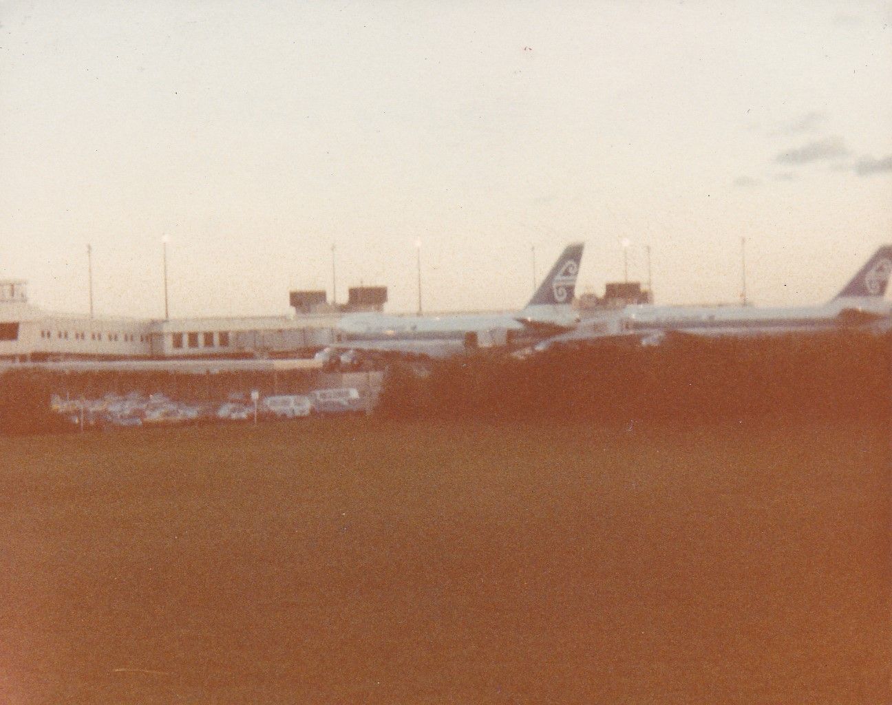 Boeing 747-200 (ZK-NZZ) - another rare photo to my collection these two brand new 747-219 delivered to Air NZ back in 1982 ZK-NZZ ZK-NZX replaced the out going DC10-30 aircraft in the fleet looking at them nosed up at gate3 & 5 as TE 5 & TE22 before the airline changed there codes to NZ taken from 100 meters zoom lens camera 1982