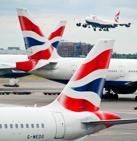 Airbus A319 (G-MEDG) - Planes Grounded At Heathrow.B747 Aircraft Landing