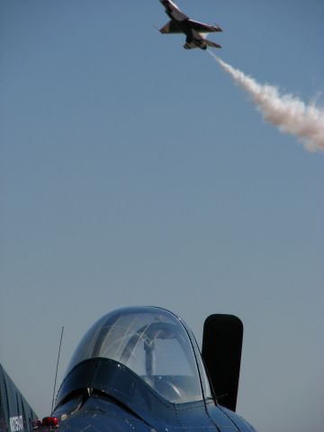 — — - T-28 with Thunderbird ? going by.  Bad shutter speed!