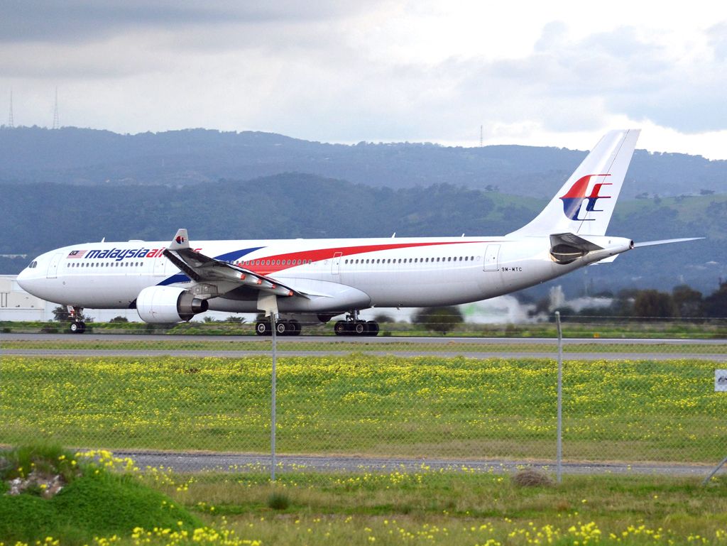 Airbus A330-300 (9M-MTC) - Rolling for take off on runway 05, for flight home to Kuala Lumpur, just before the arrival of a rain storm. Thursday 12th July 2012.