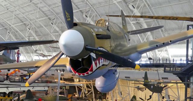 — — - Curtiss P-40E Kittyhawk exhibited at the Steven F. Udvar-Hazy Center | National Air and Space Museum.