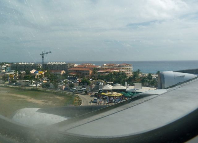 Airbus A340-200 (F-GLZS) - View over Sunset-Bar seconds before touchdown in St. Maarten. Note the famous Surfboard