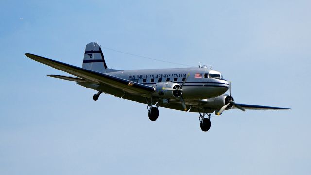 Douglas DC-3 (N877MG) - Historic Flight’s DC-3C (msn 4193) on final to Rwy 16R on 5.11.19.  The aircraft departed later in the day to join other DC3's / C47's for the D-Day 75th Anniversary. 