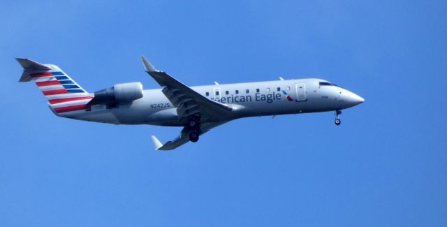 Canadair Regional Jet CRJ-200 (N242JS) - On final is this 2004 American Eagle Canadair Regional Jet 200ER in the Spring of 2019.