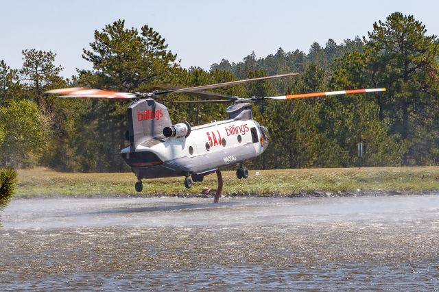 Boeing CH-47 Chinook (N405AJ) - N405AJ pausing for a drink at Cedar Springs Reservoir while working the Alexander Mountain Fire near Drake, Colorado 8/3/24.