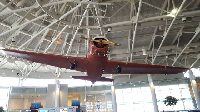 Mooney M-20 (N1KQ) - This interesting airplane is hanging in the D Concourse of the Charlotte Douglas International Airport.