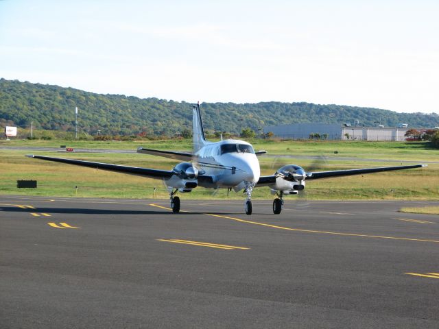 Beechcraft King Air 90 (N575C) - A Beechcraft C-90 taxing at Queen City