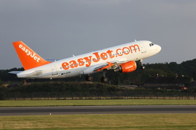 Airbus A319 (G-EZAG) - Early evening departure, photographed from top of multi-storey car park 