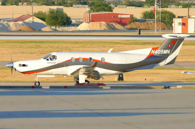 Pilatus PC-12 (N405MN) - Taxiing at sunset.