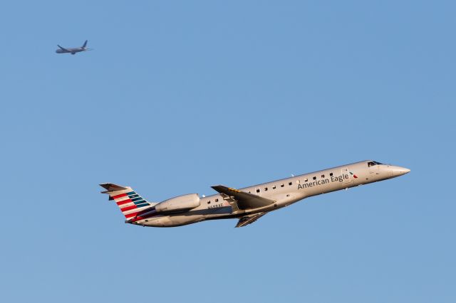 Embraer ERJ-145 (N688AE) - Envoy jungle jet departing with a United 777 inbound to ORD overhead