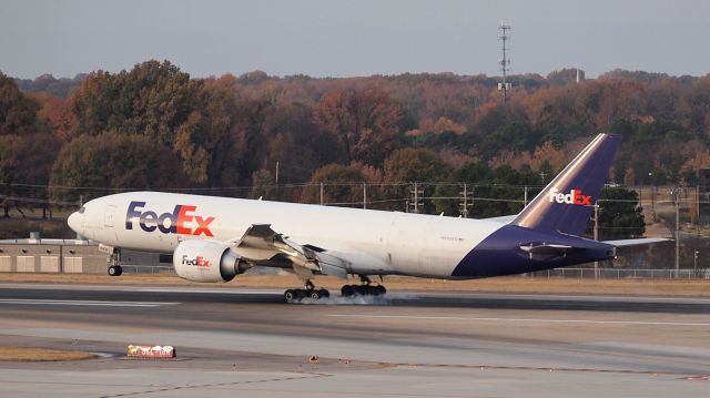 BOEING 777-200LR (N868FD) - "Joseph" touchdown on 18R.