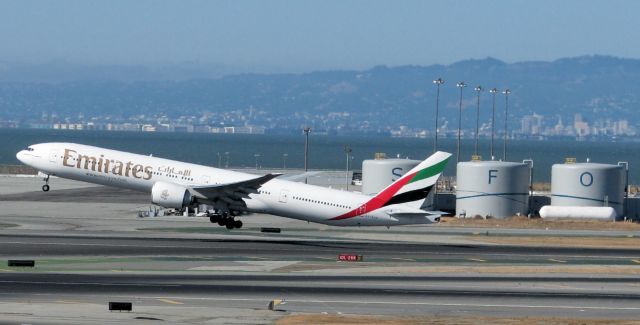 Boeing 777-200 (A6-ECD) - Departing San Francisco International from 28R.