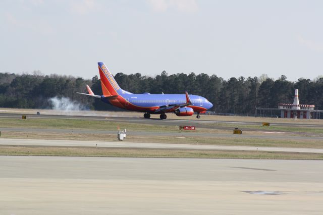 Boeing 737-700 (N414WN) - N414WN touching down runway 23L