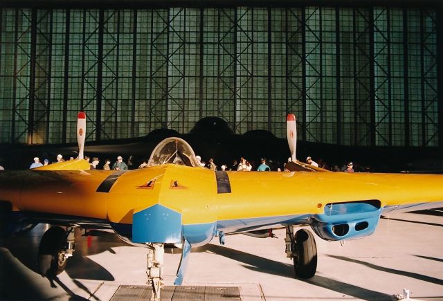 — — - Northrop N-9M Flying Wing on display at the Edwards AFB 10-18-1997 Open House and Air Show. Note the shadow of the B-2 in the back ground.