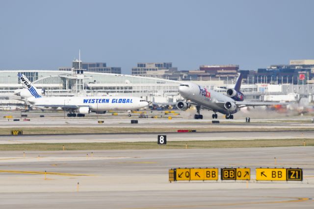 Boeing MD-11 (N610FE) - A Meeting of Tri-Hogs